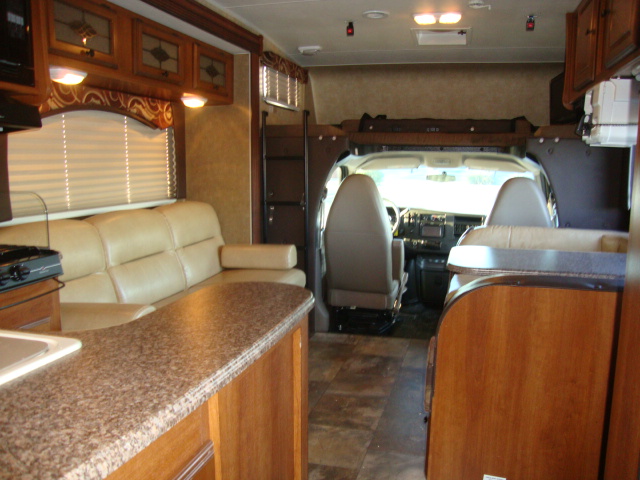 The Coachmen 320BH Class C Bunkhouse features a sofa, providing a cozy seating area for relaxing or entertaining