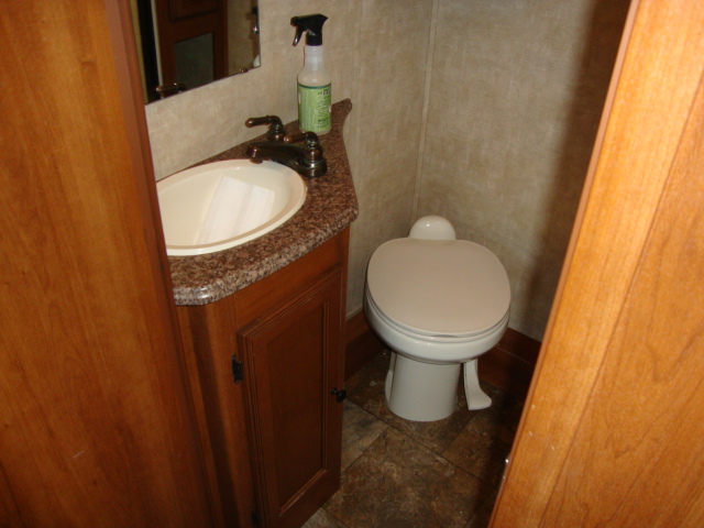 The Coachmen 320BH Class C Bunkhouse is equipped with a toilet setup, providing convenience for travelers on the road