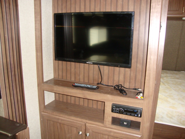 The Pioneer RL250 travel trailer comes with a TV setup, perfect for entertainment while on the road