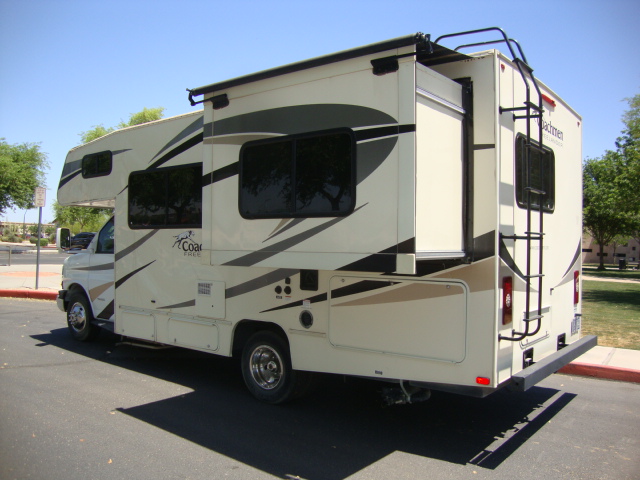 The Coachmen Freelander 21-RS is parked on the road, showcasing its compact and versatile design